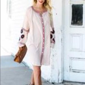 Embroidered pocket dress.